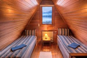 Two rooms are on the upper floor of the cottage