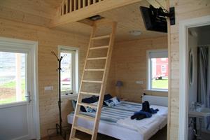Double bed in studio cottage (24m2)