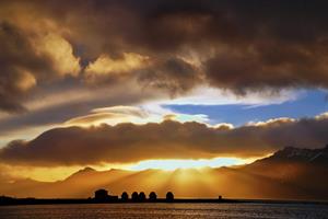 Rays of sun reaching down to Mjóeyri