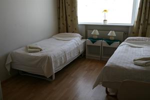 Twin room with shared bathroom