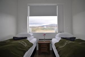 Twin room with shared bathroom