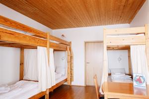 Economy family room with private bathroom. The room accommodates 6 persons in bunk beds. 