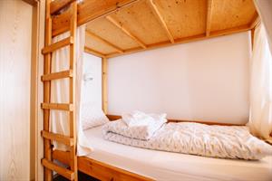 Economy family room with private bathroom. The room accommodates 6 persons in bunk beds. 