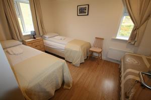 Twin room with shared bathroom
