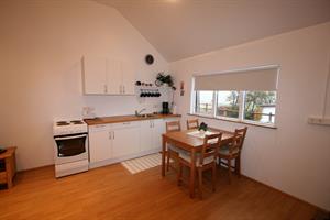 Kitchen with a cooking facility of apartment