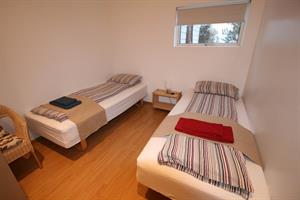 Twin room with shared bathroom