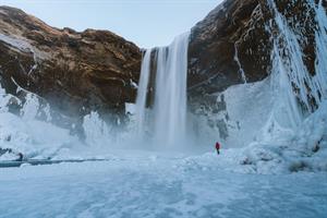 Skógafoss banks covered in snow
