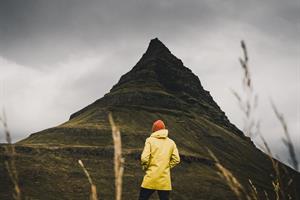 Man standing in front of Kirkjufell