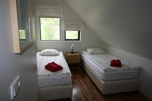 Twin room with shared bathroom