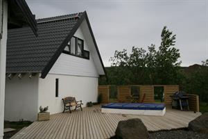 Spacious veranda with a hot tub