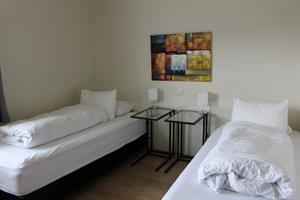 Twin bed - room with private bathroom