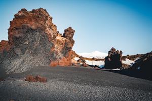 Walk along Djúpalón scenic black sand beach in Snæfellsnes.