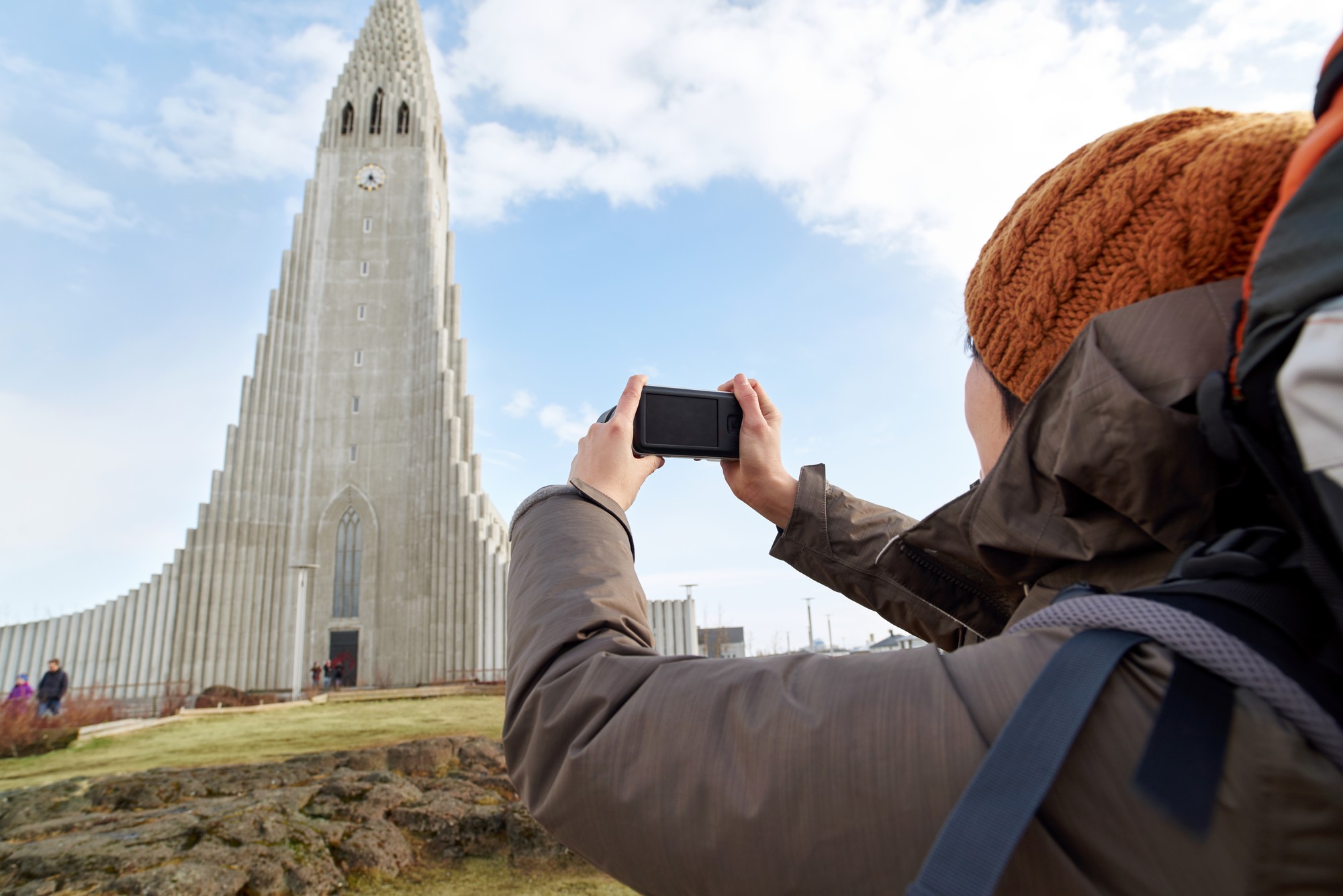 Woman photographing Hallgrímskirkja Church Woman photographing Hallgrímskirkja Church