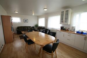 Living room and dining area in the house were guests share bathrooms