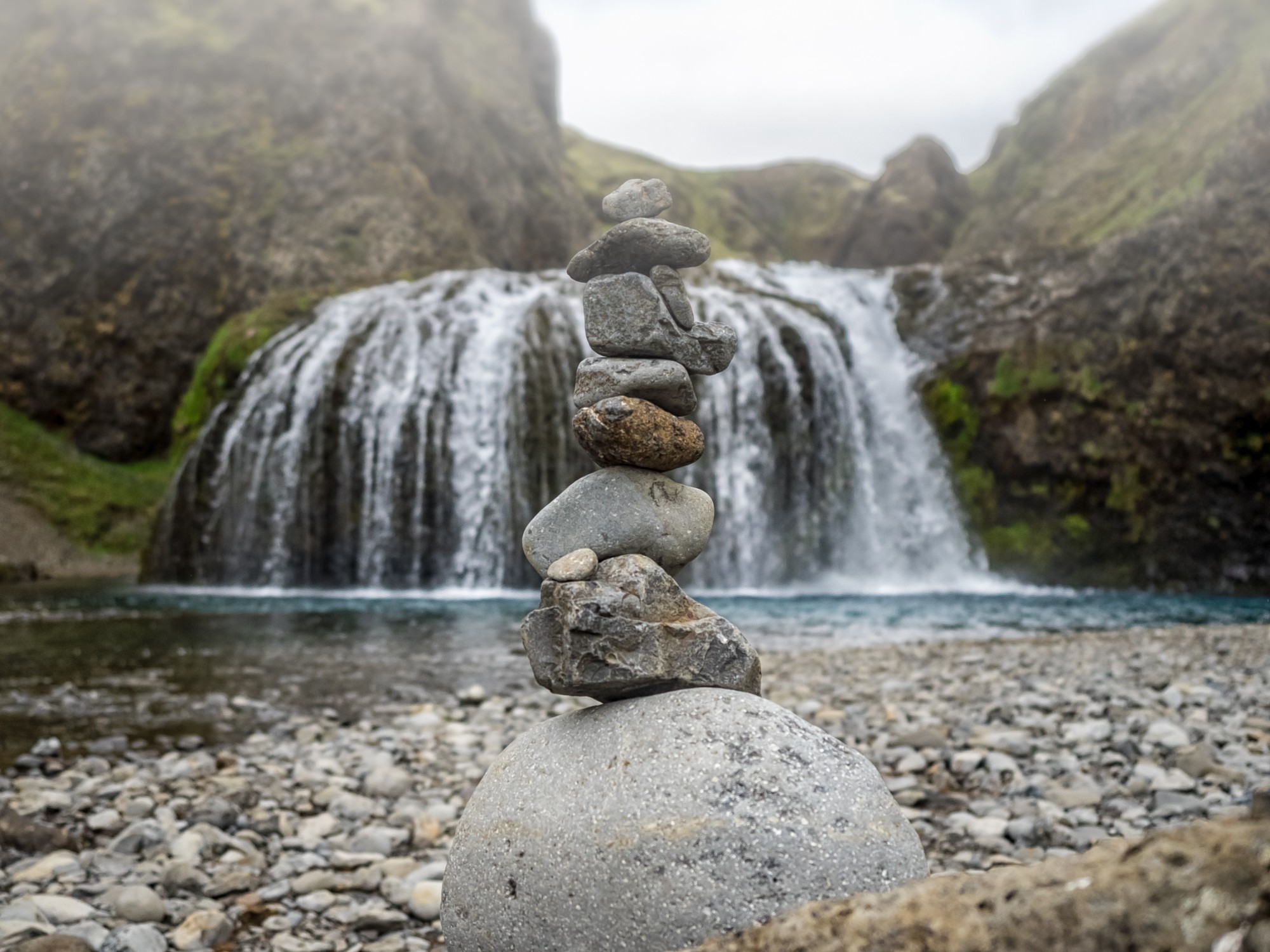 Stone cairn in front of the Stjornarfoss.jpg Stone cairn in front of the Stjornarfoss.jpg