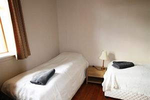 Twin room with shared bathroom