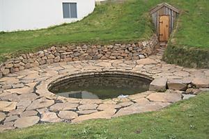 The ancient pool Snorralaug in West Iceland