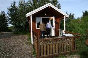 Double room with private bathroom and an additional bunk bed in a unit cottage