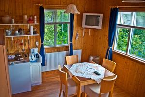 Double room with and additional sofa bed and private bathroom in a unit cottage
