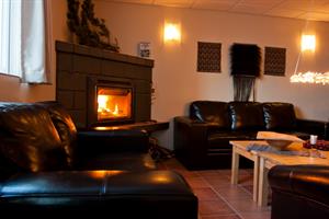 A cosy living room with a fire place