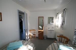 Twin room with shared bathroom