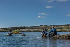Enjoying a snorkeling tour in Þingvellir National Park