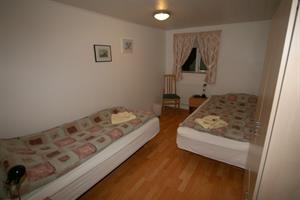 Twin room with shared bathroom