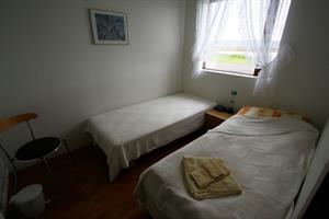 Twin room with shared bathroom