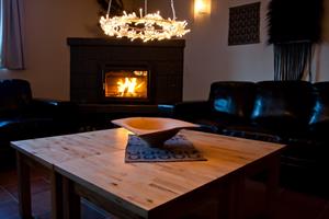 A cosy living room with a fire place