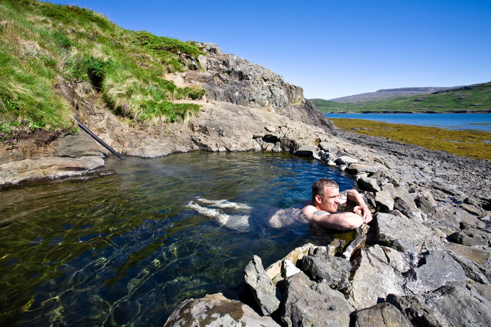 Natural hot spring pool in Vatnsfjörður, Westfjords Natural hot spring pool in Vatnsfjörður, Westfjords